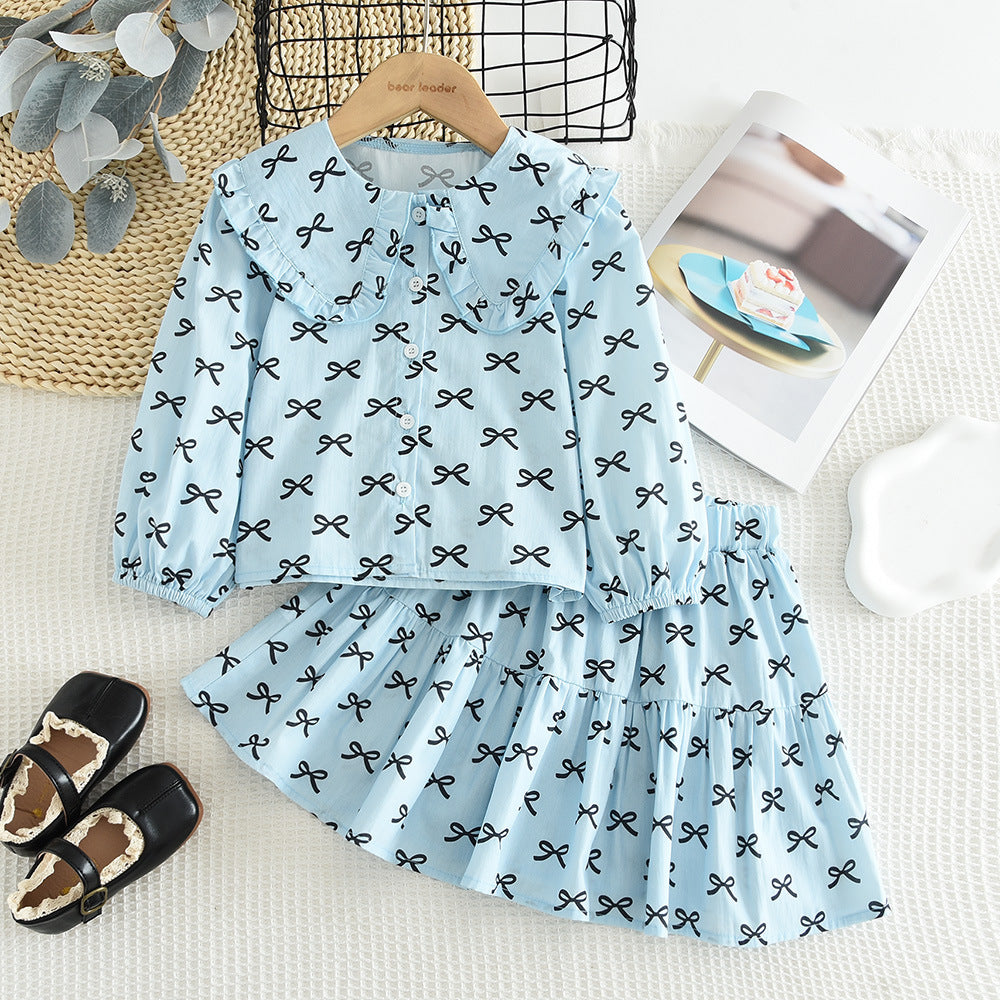 Cross-Border Hot-Selling Korean-Style Children's Clothing New Bow Print Long-Sleeve Doll Shirt Short Skirt Girls' 2026 Spring and Autumn Set